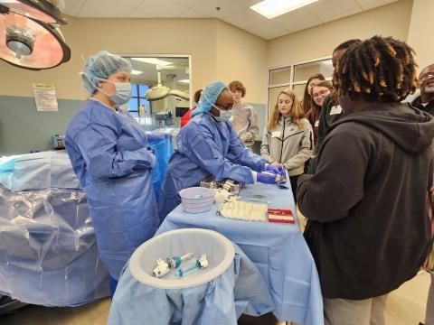 Surgical techs interact with students